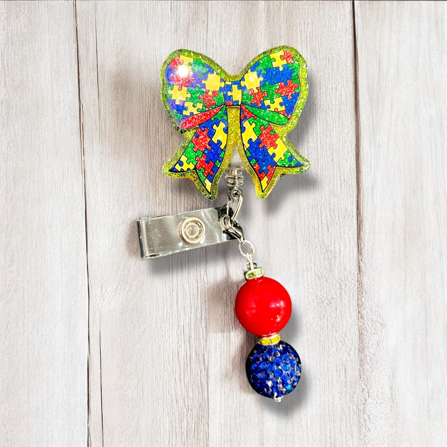 Autism Puzzle Bow Awareness Badge Reel